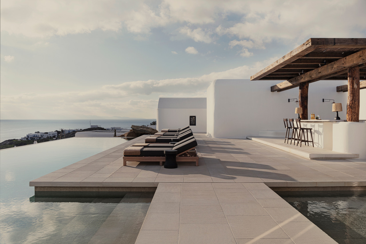 Select Green Hotels Kalesma Mykonos luxury five star hotel pool and bar with sunloungers