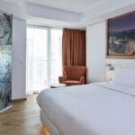 Select Green Hotels Olive Green Heraklion Zimmer mit orangen Gardinen