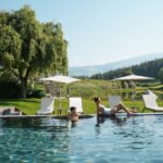 Select Green Hotels Seehof Nature Retreat Adults-Only Hotel couple by the pool
