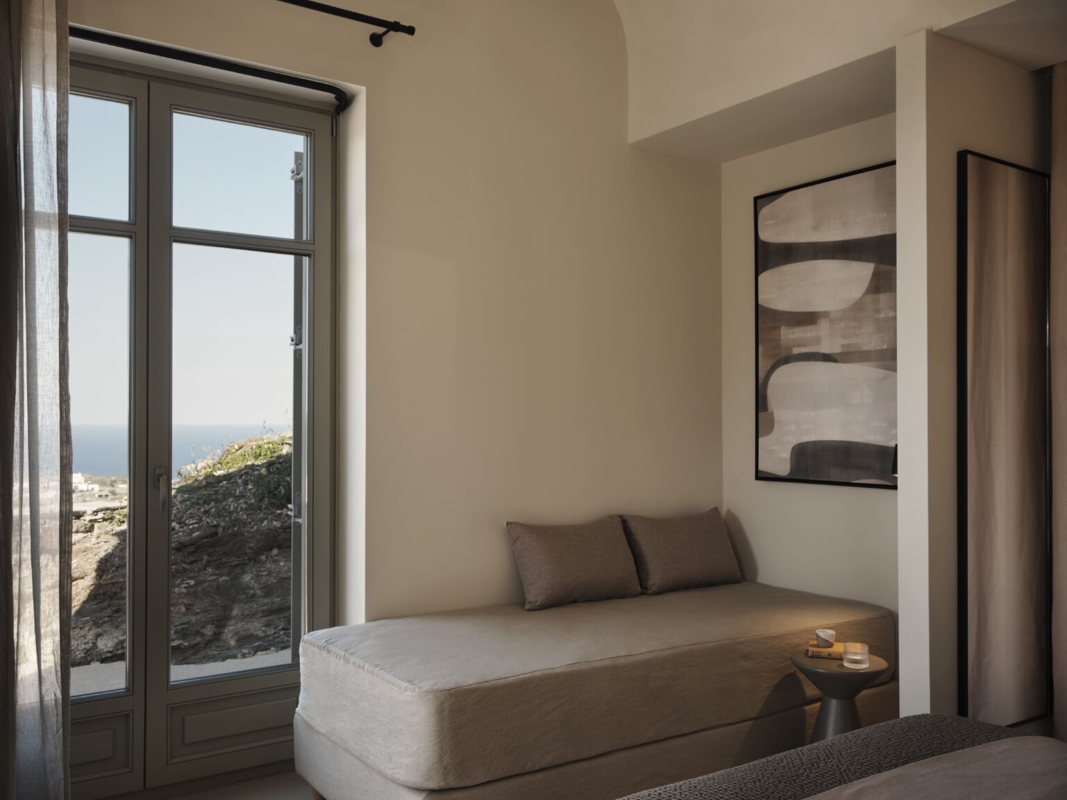 Stamna Sifnos Select Green Hotels comfortable couch with hotel room view to the sea
